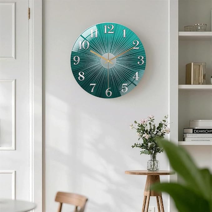 12 Inch Teal Sunburst Glass Wall Clock Silent Modern Art Decor | Silent glossy clock with an elegant teal sunburst and silver numbers, perfectly tracking time for your modern living room