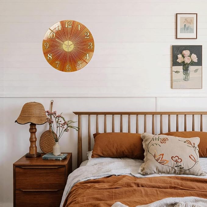 24 Inch Orange Sunburst Glass Wall Clock Silent Art Decor | Silent glossy clock with warm orange sunburst and gold numbers, accurately tracking time for your retro living room