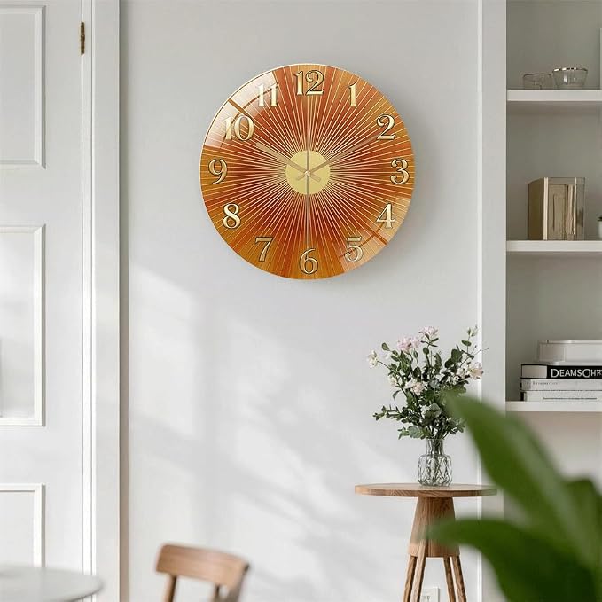 24 Inch Orange Sunburst Glass Wall Clock Silent Art Decor | Silent glossy clock with warm orange sunburst and gold numbers, accurately tracking time for your retro living room