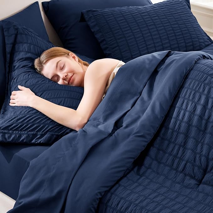 CozyLux Queen Comforter Set Navy Blue, 7 Pieces Seersucker Textured Luxury Bed in a Bag Queen, All Seasons Soft Bedding Sets with Down Alternative Comforter, Sheets, Pillowcases & Shams, Home Gift