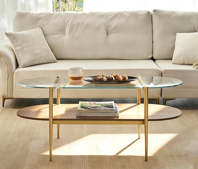 Shrine Oval Coffee Table, Mid-Century Modern Design, 2-Tier Structure, Clear Glass Top and Walnut MDF Shelf, 47" D x 21" W x 17" H, Sleek Conical Metal Legs with Gold Finish